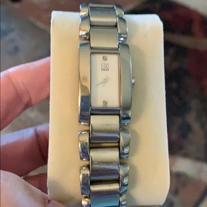 “ESQ” Movado Ladies Watch. Has two diamonds .